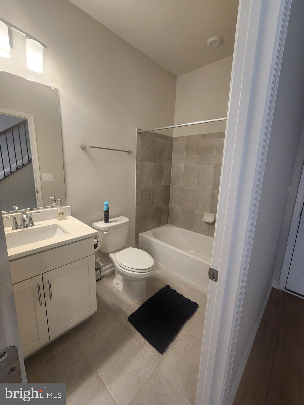 234 Mainstream Drive Laurel, MD 20724 - Photo 15 of 40 a bathroom with a sink a toilet and shower