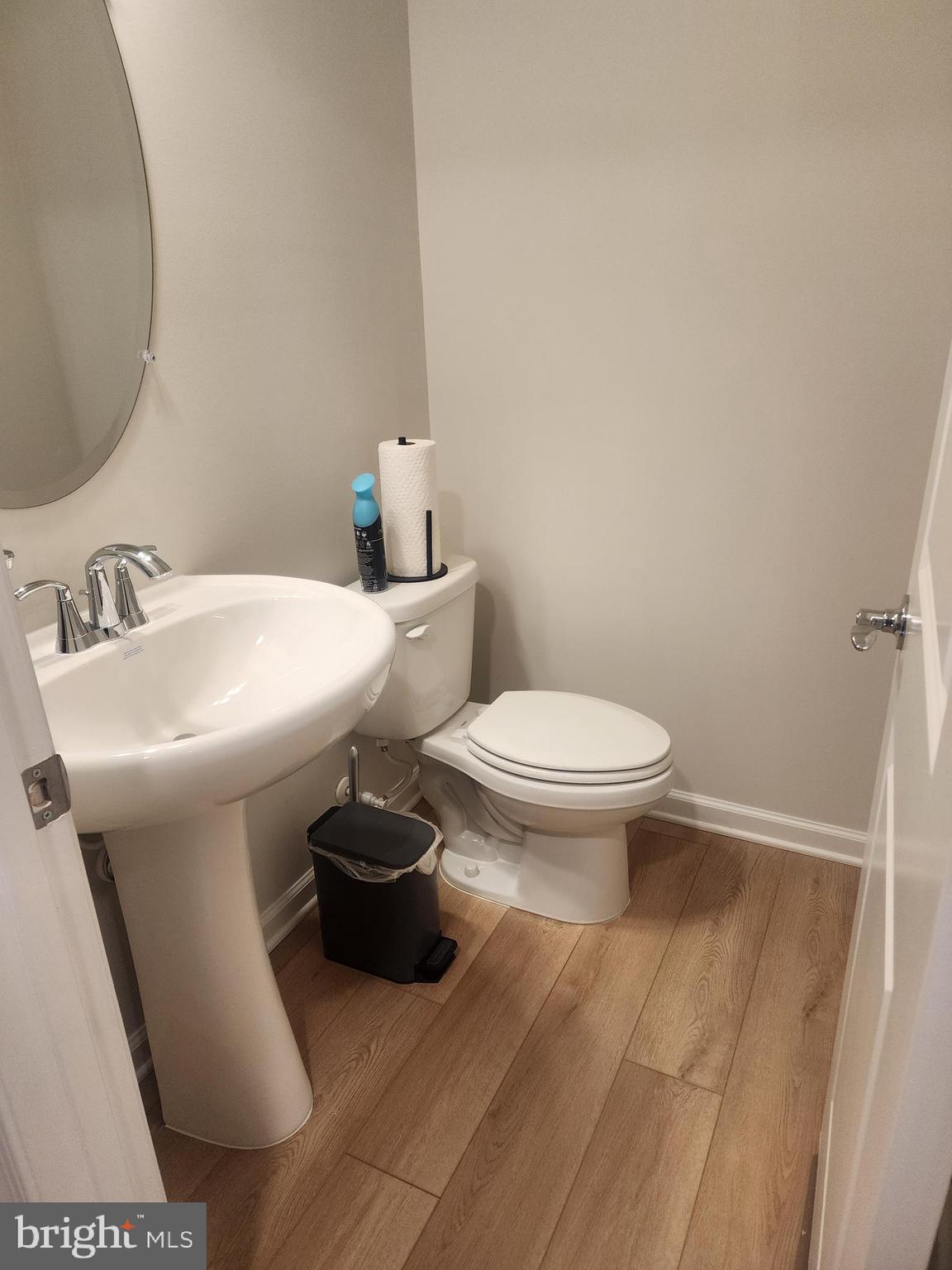 234 Mainstream Drive Laurel, MD 20724 - Photo 17 of 40 a bathroom with a sink toilet and a mirror