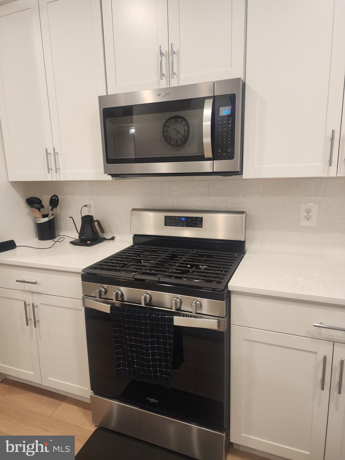 234 Mainstream Drive Laurel, MD 20724 - Photo 20 of 40 a stove top oven sitting inside of a kitchen