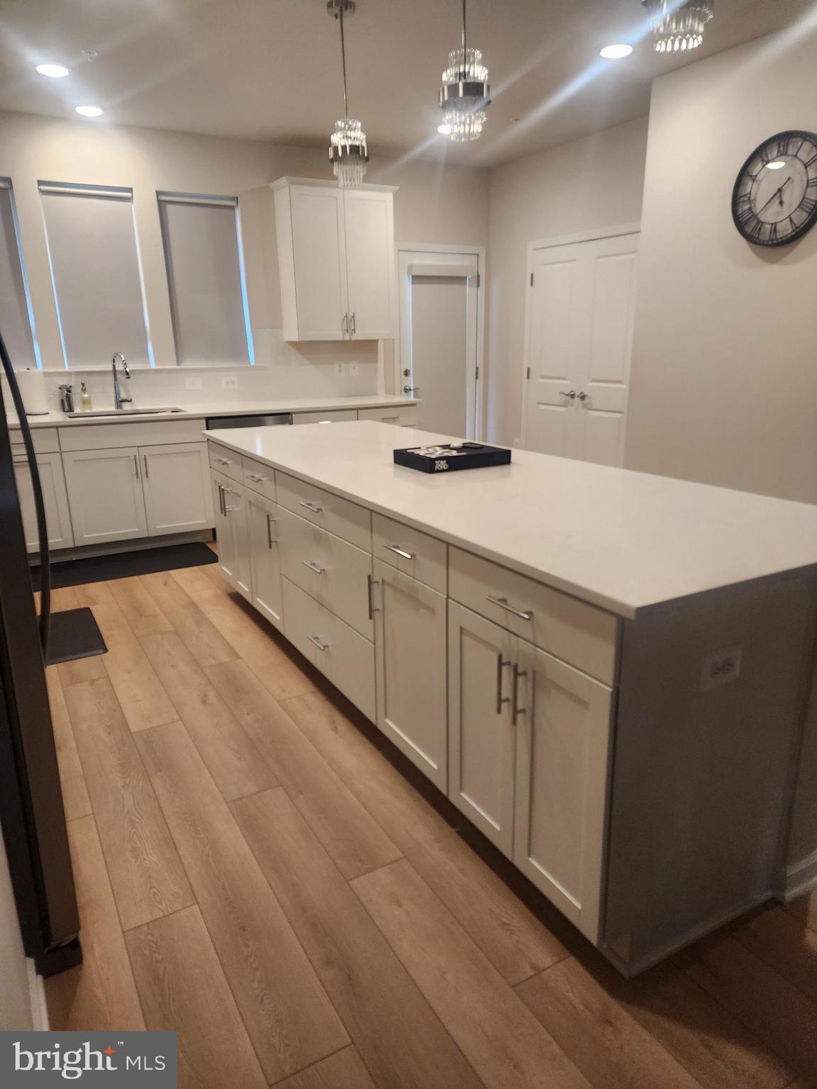 234 Mainstream Drive Laurel, MD 20724 - Photo 21 of 40 a large white kitchen with a sink and dishwasher