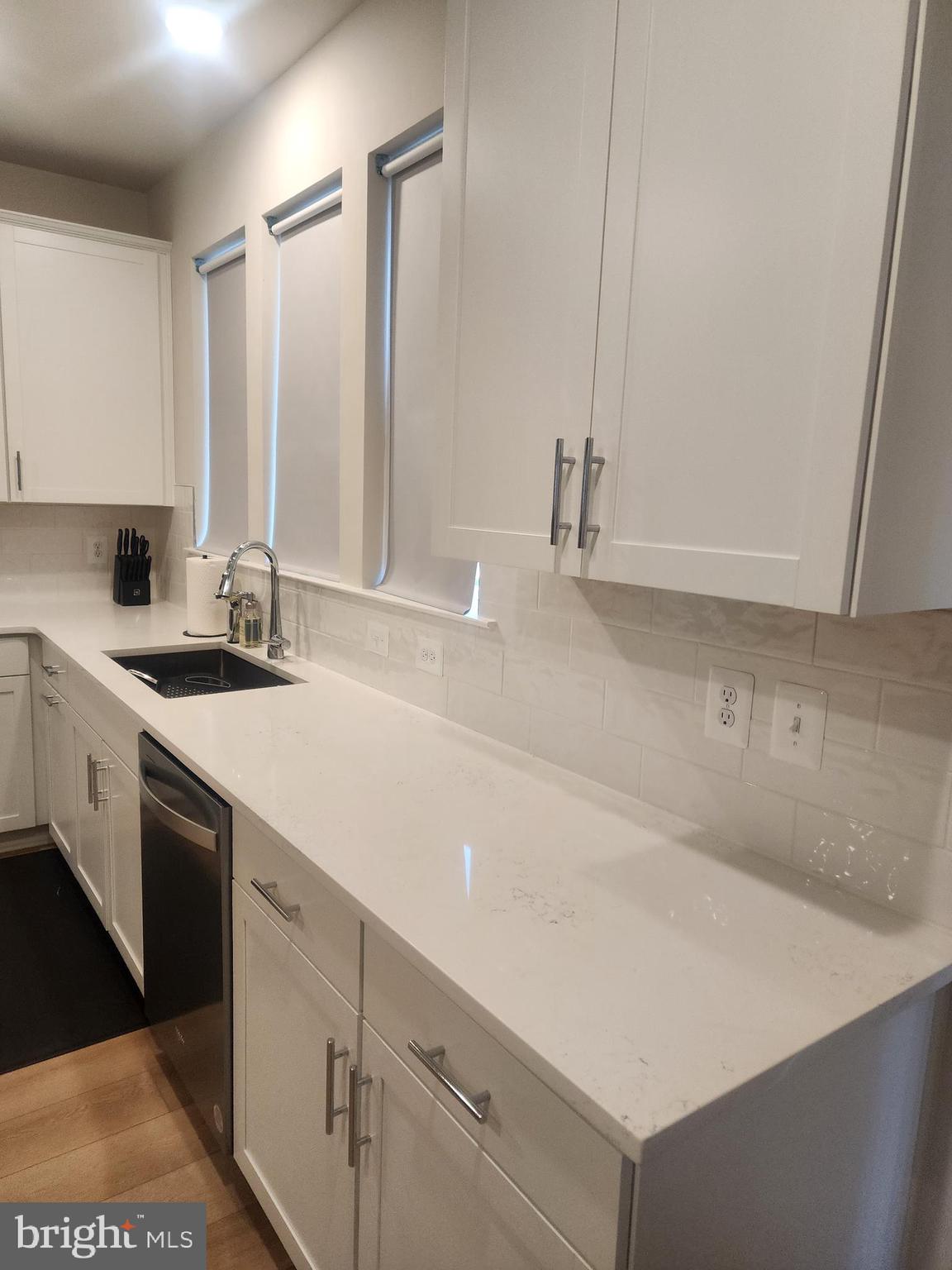 234 Mainstream Drive Laurel, MD 20724 - Photo 22 of 40 a kitchen with a sink and cabinets
