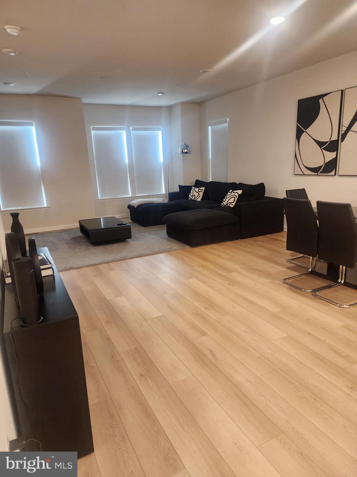 234 Mainstream Drive Laurel, MD 20724 - Photo 26 of 40 a large bedroom with a bed and lamp