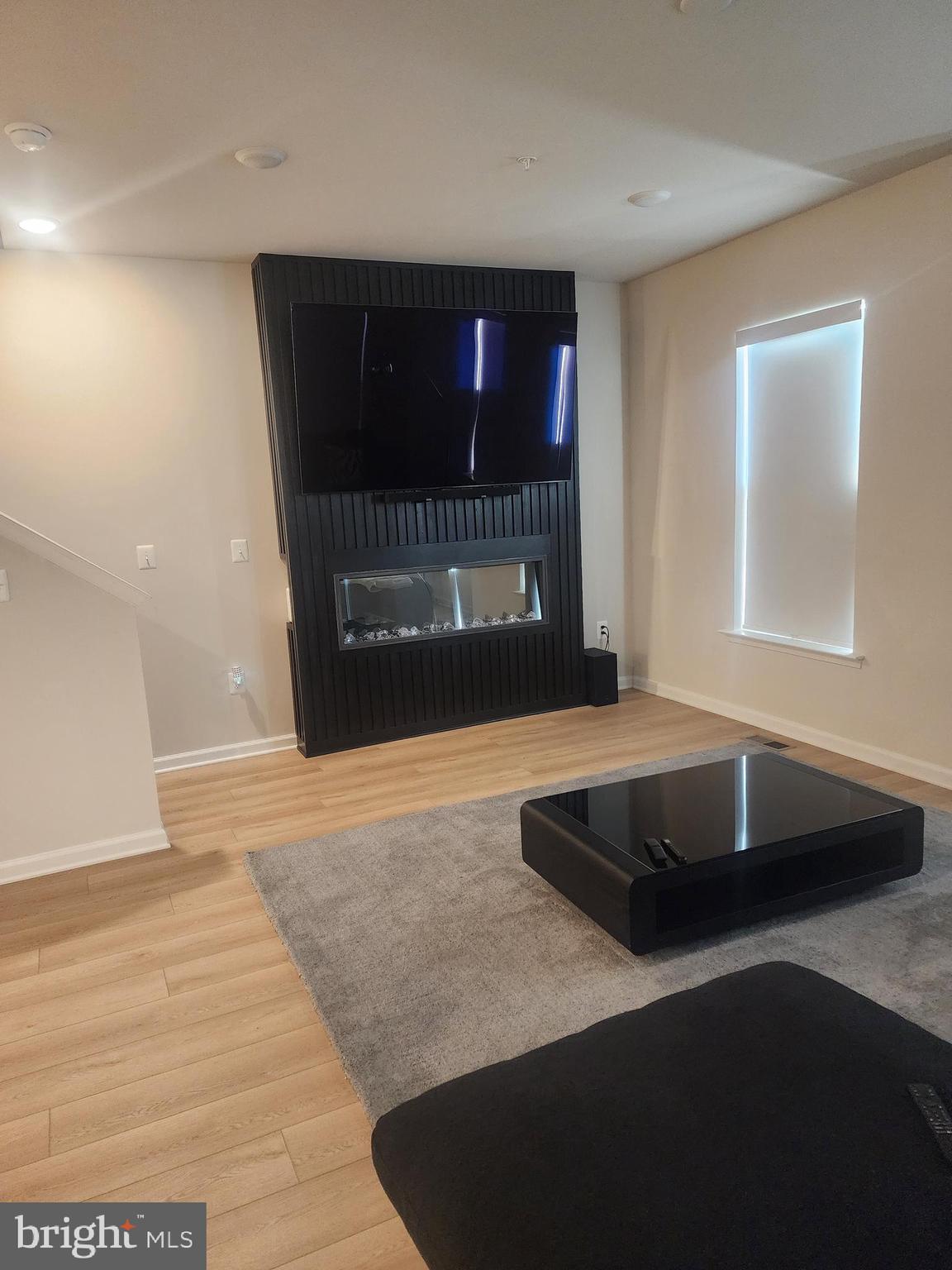 234 Mainstream Drive Laurel, MD 20724 - Photo 28 of 40 a living room with a fireplace and a walk in closet