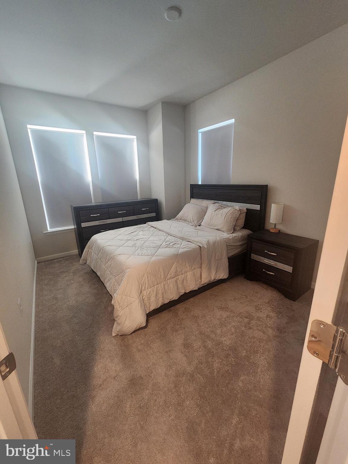 234 Mainstream Drive Laurel, MD 20724 - Photo 35 of 40 a bedroom with a bed and window