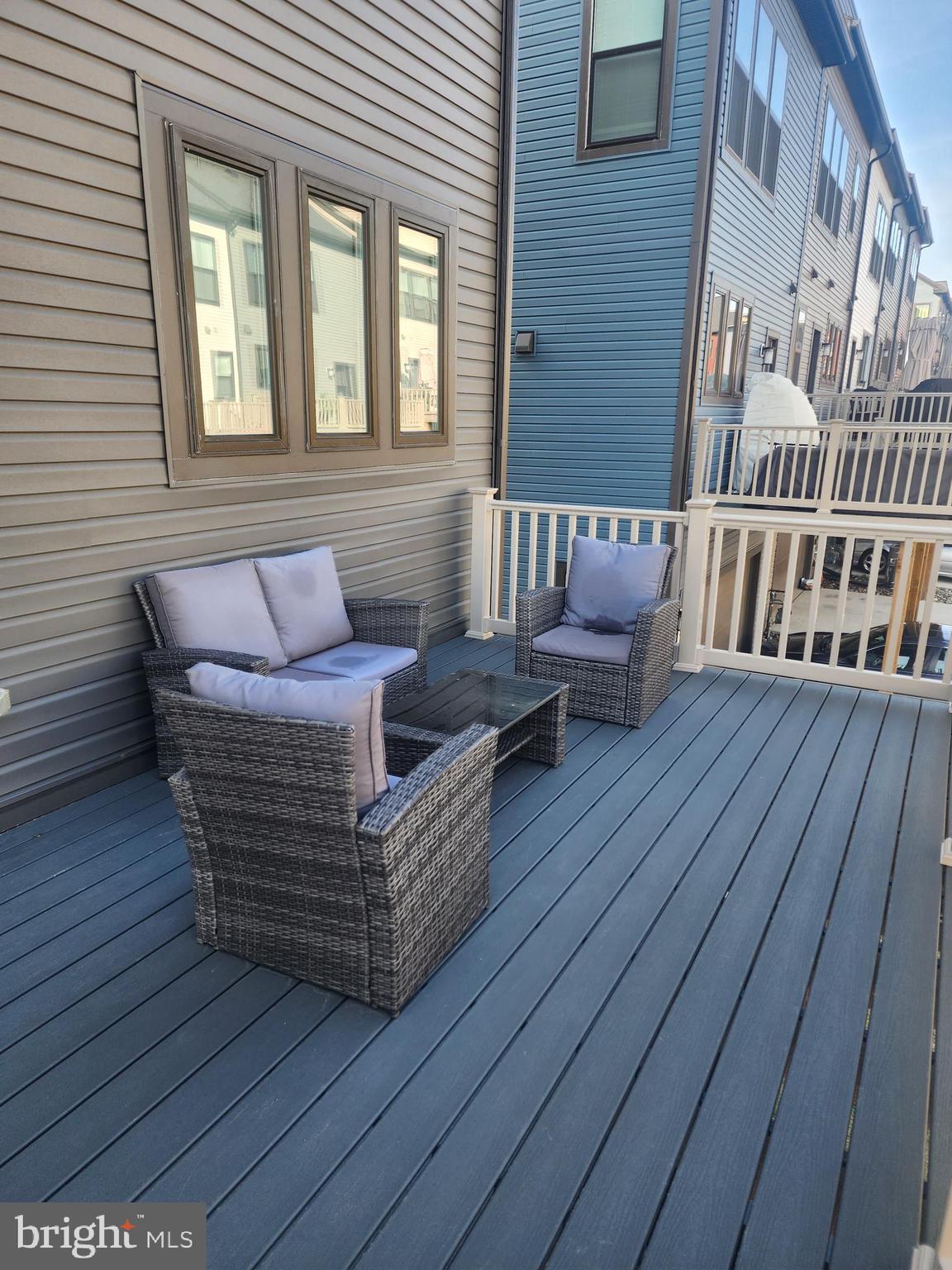 234 Mainstream Drive Laurel, MD 20724 - Photo 40 of 40 a view of a wooden deck with furniture