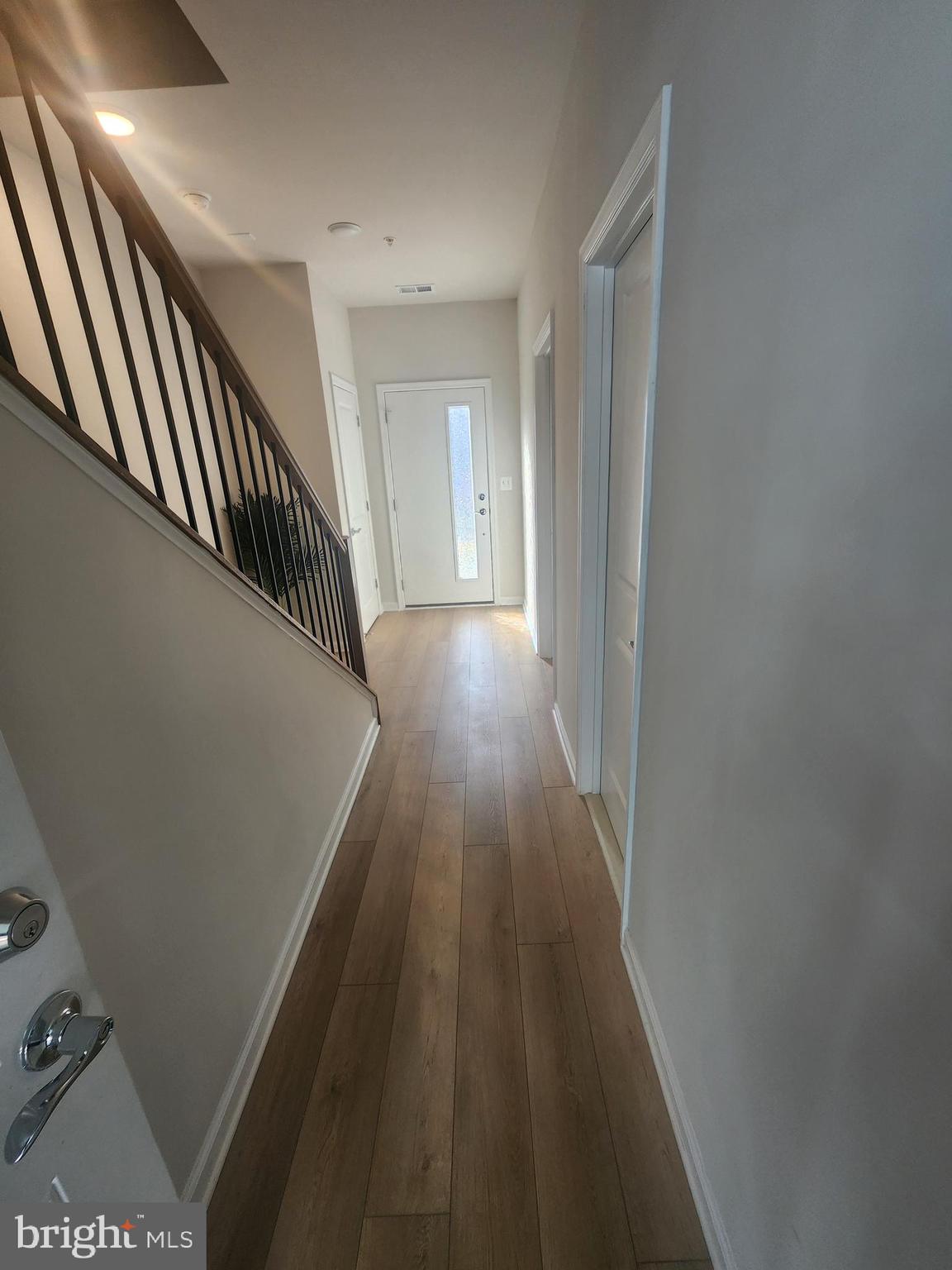 234 Mainstream Drive Laurel, MD 20724 - Photo 6 of 40 a view of a hallway with wooden floor