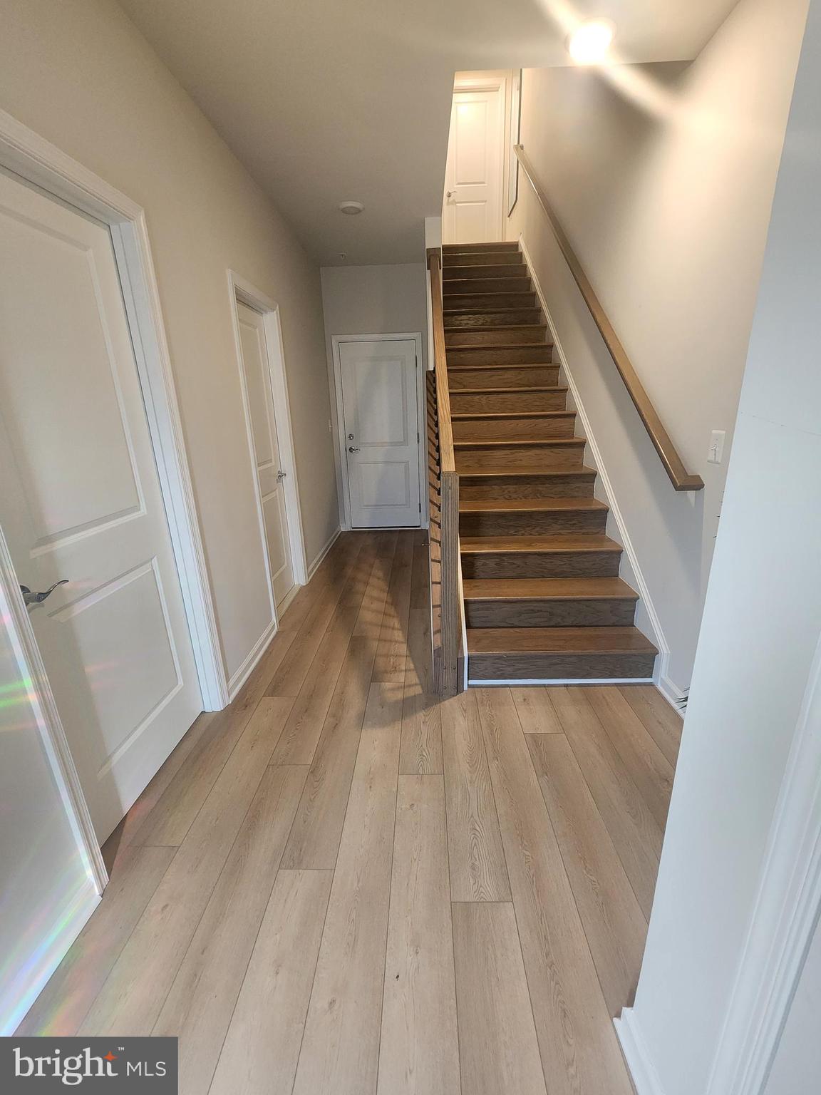 234 Mainstream Drive Laurel, MD 20724 - Photo 7 of 40 a view of a hallway with wooden floor and entryway