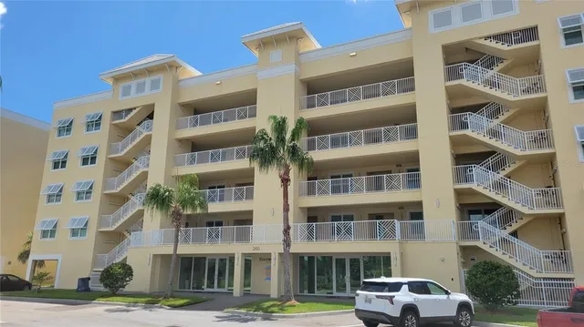 a front view of a building with a yard