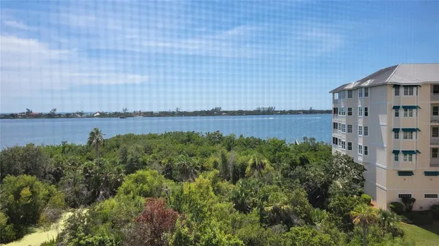 a view of a building with lake view and mountain view