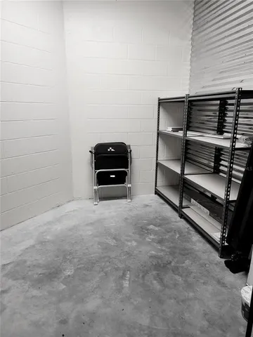 an aerial view of residential houses with outdoor space and street view