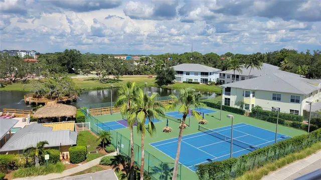 an aerial view of a house with a lake view