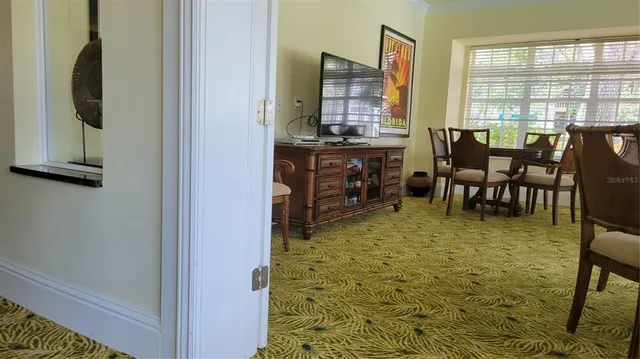 a living room with a book shelf