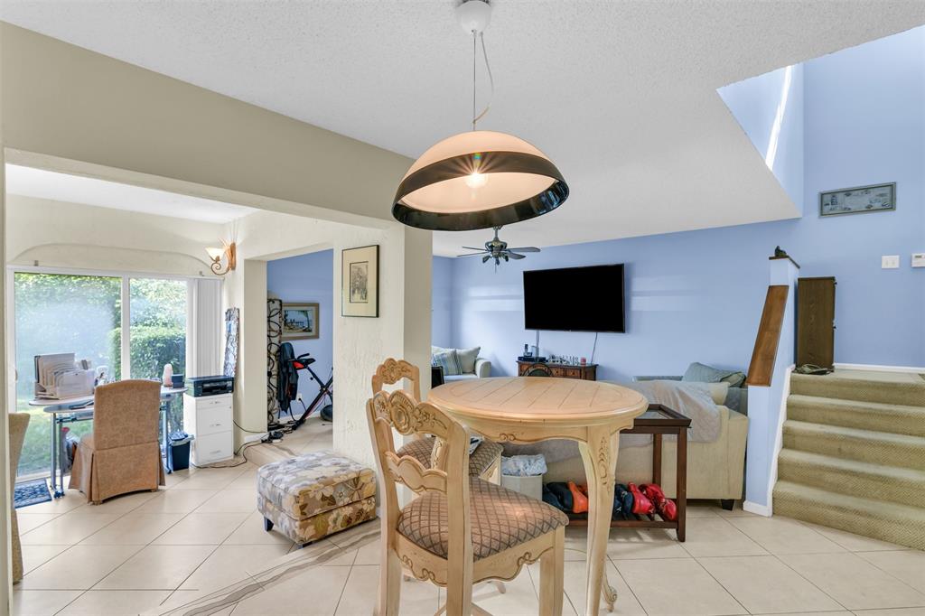 6693 Via Regina, Unit 6693 Boca Raton, FL 33433 - Photo 12 of 27 a outdoor space with furniture and flat screen tv