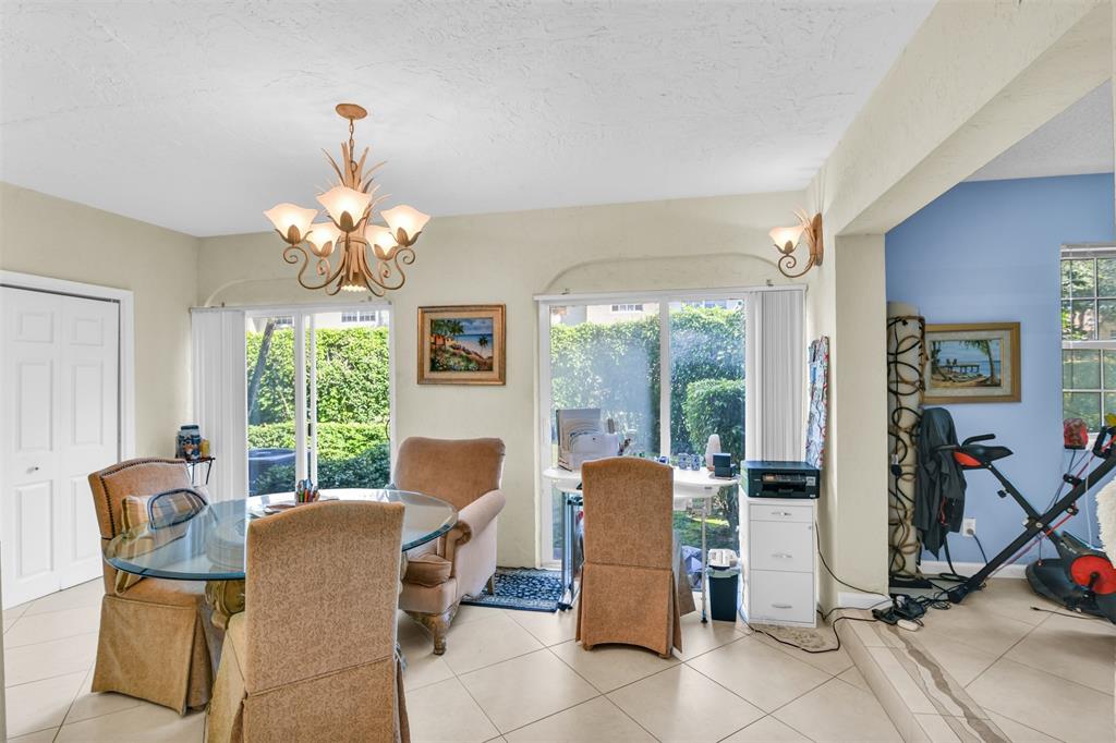 6693 Via Regina, Unit 6693 Boca Raton, FL 33433 - Photo 13 of 27 a view of a dining room with furniture window and outside view
