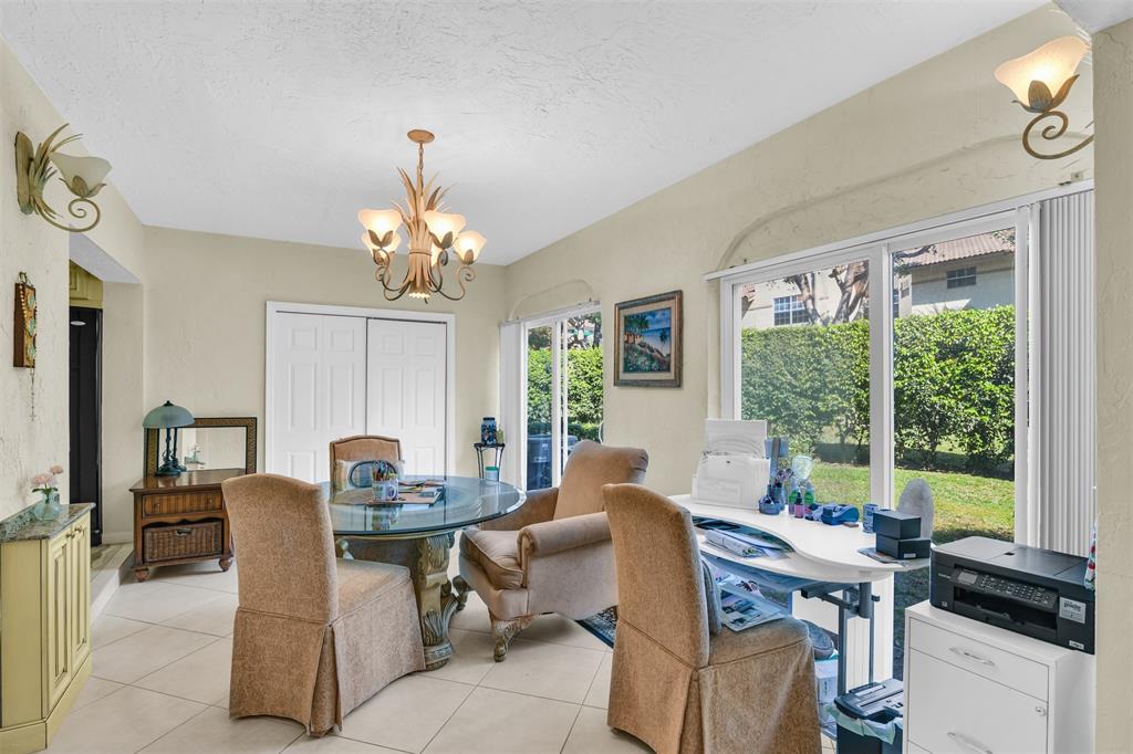6693 Via Regina, Unit 6693 Boca Raton, FL 33433 - Photo 14 of 27 a view of a dining room with furniture window and outside view