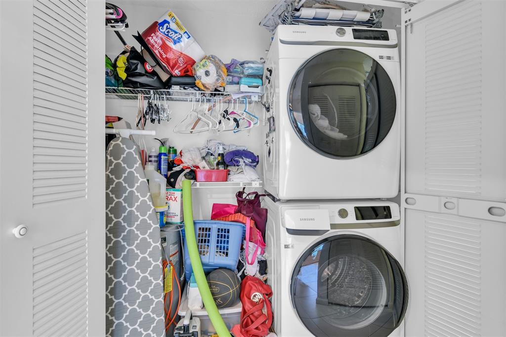 6693 Via Regina, Unit 6693 Boca Raton, FL 33433 - Photo 19 of 27 a utility room with dryer and washer