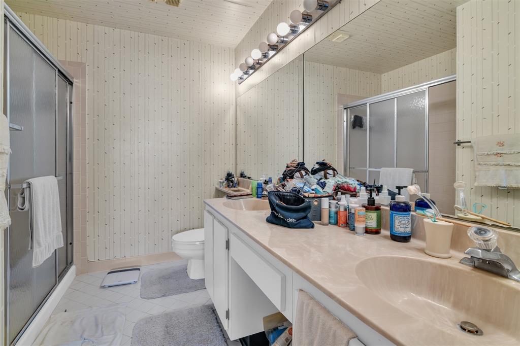 6693 Via Regina, Unit 6693 Boca Raton, FL 33433 - Photo 24 of 27 a bathroom with a sink double vanity and a toilet