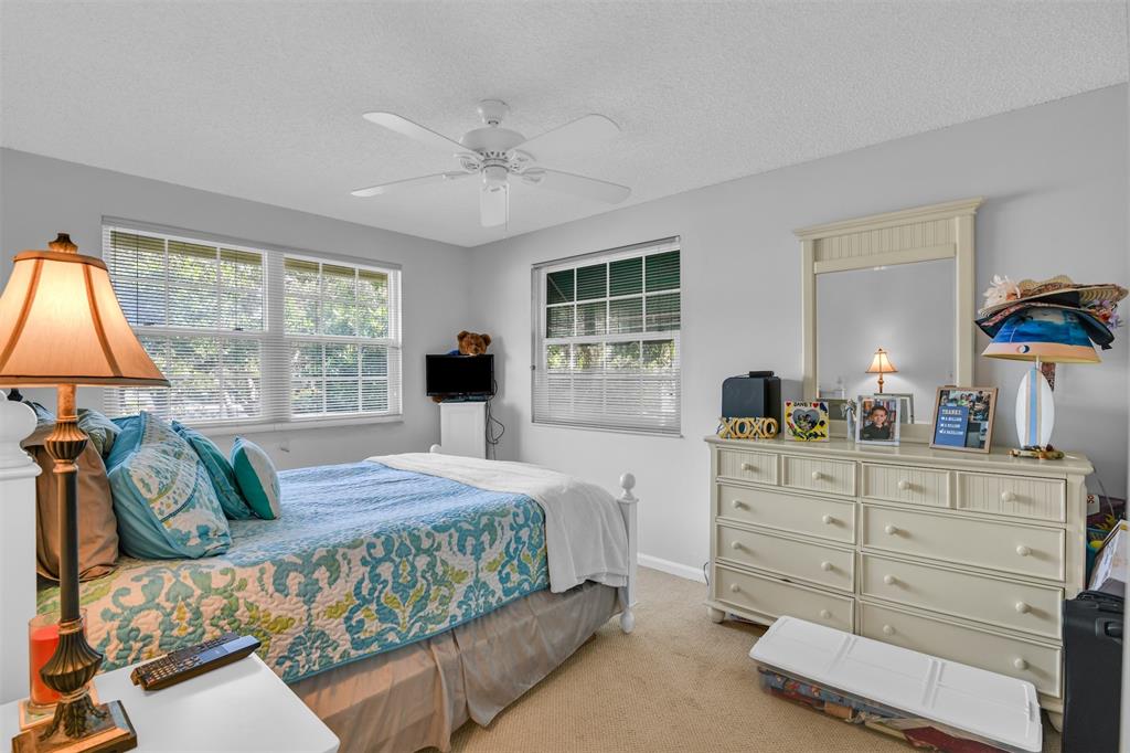 6693 Via Regina, Unit 6693 Boca Raton, FL 33433 - Photo 26 of 27 a bedroom with a bed and window