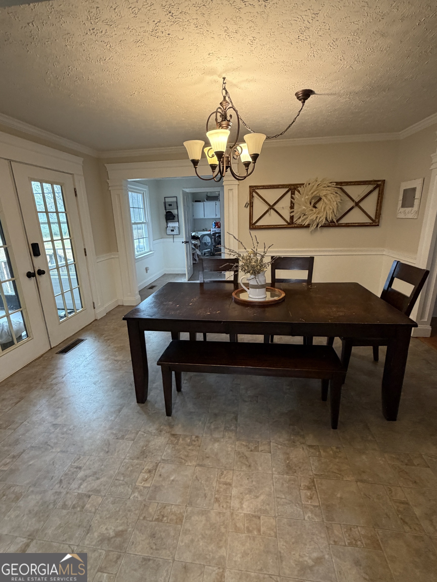 146 Burkett Road Thomaston, GA 30286 - Photo 11 of 13 a room with table chairs and wooden floor