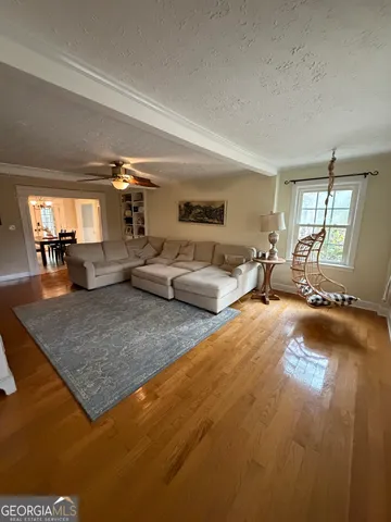 a living room with furniture and a table