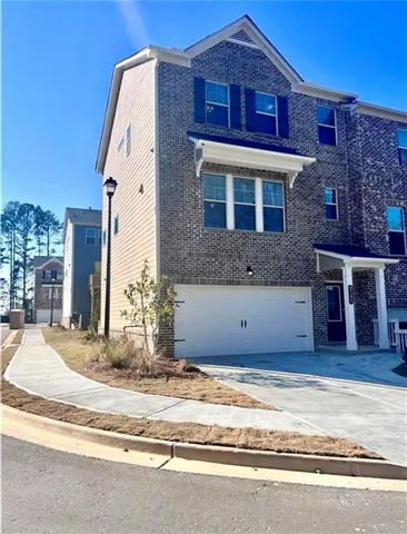 a view of a brick house with a large windows