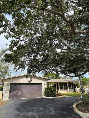 a view of house with yard