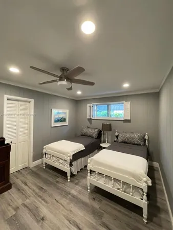 a bedroom with bed and window