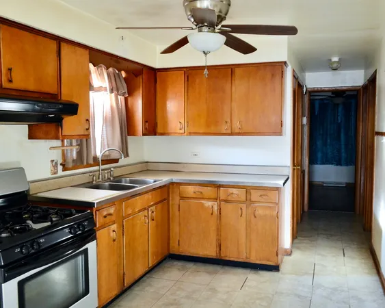 a kitchen with a stove and a microwave