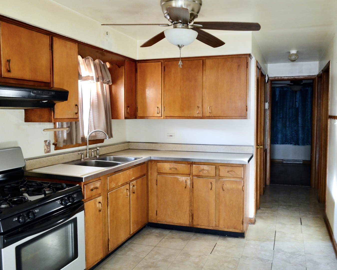 9238 South Normal Avenue Chicago, IL 60620 - Photo 5 of 13 a kitchen with a stove and a microwave
