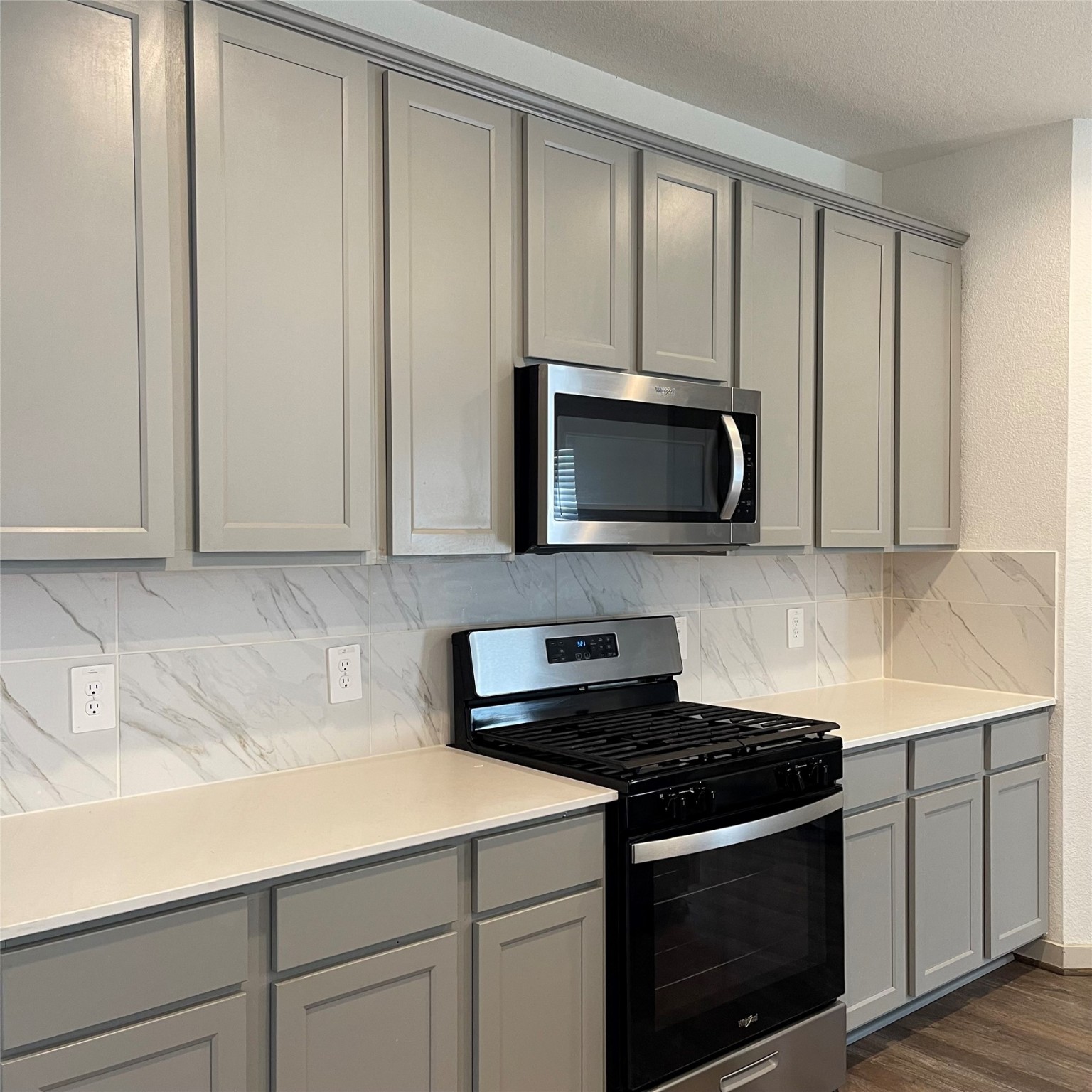 6814 Bradford Terrace Road Richmond, TX 77407 - Photo 12 of 31 a kitchen with granite countertop white cabinets and stainless steel appliances
