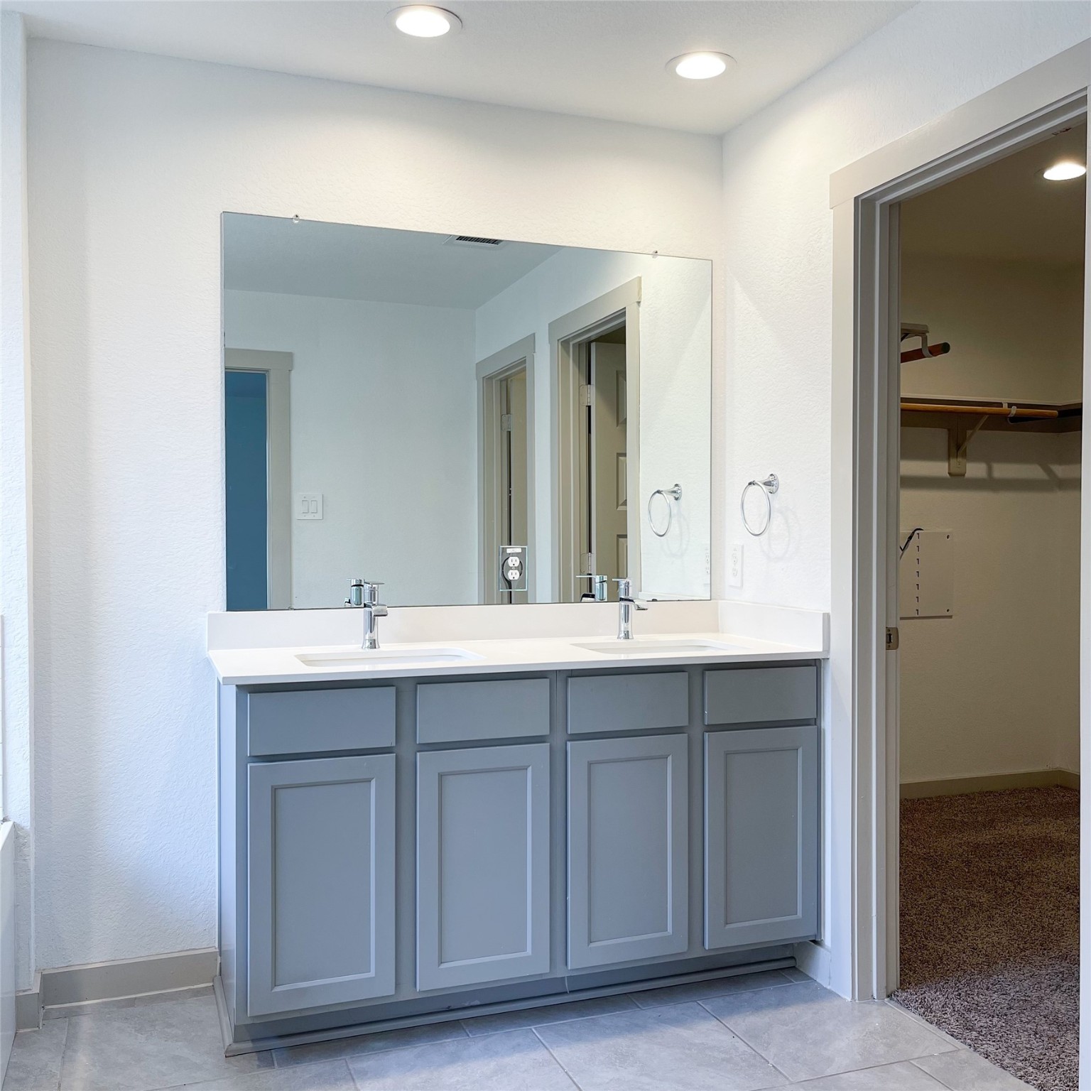6814 Bradford Terrace Road Richmond, TX 77407 - Photo 22 of 31 a bathroom with a double vanity sink and mirror