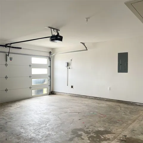 a view of cabinets a wooden floor and windows in a room
