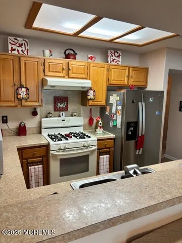 a kitchen with a stove and a sink