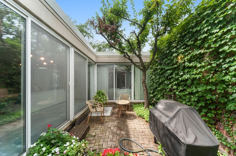 14 Avon Road Northbrook, IL 60062 - Photo 22 of 23 a view of backyard with patio and outdoor seating