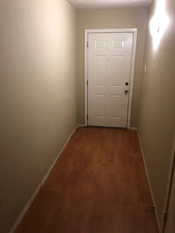 an empty room with closet area