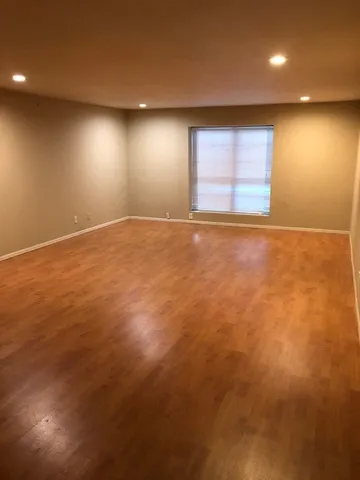 an empty room with windows and closet