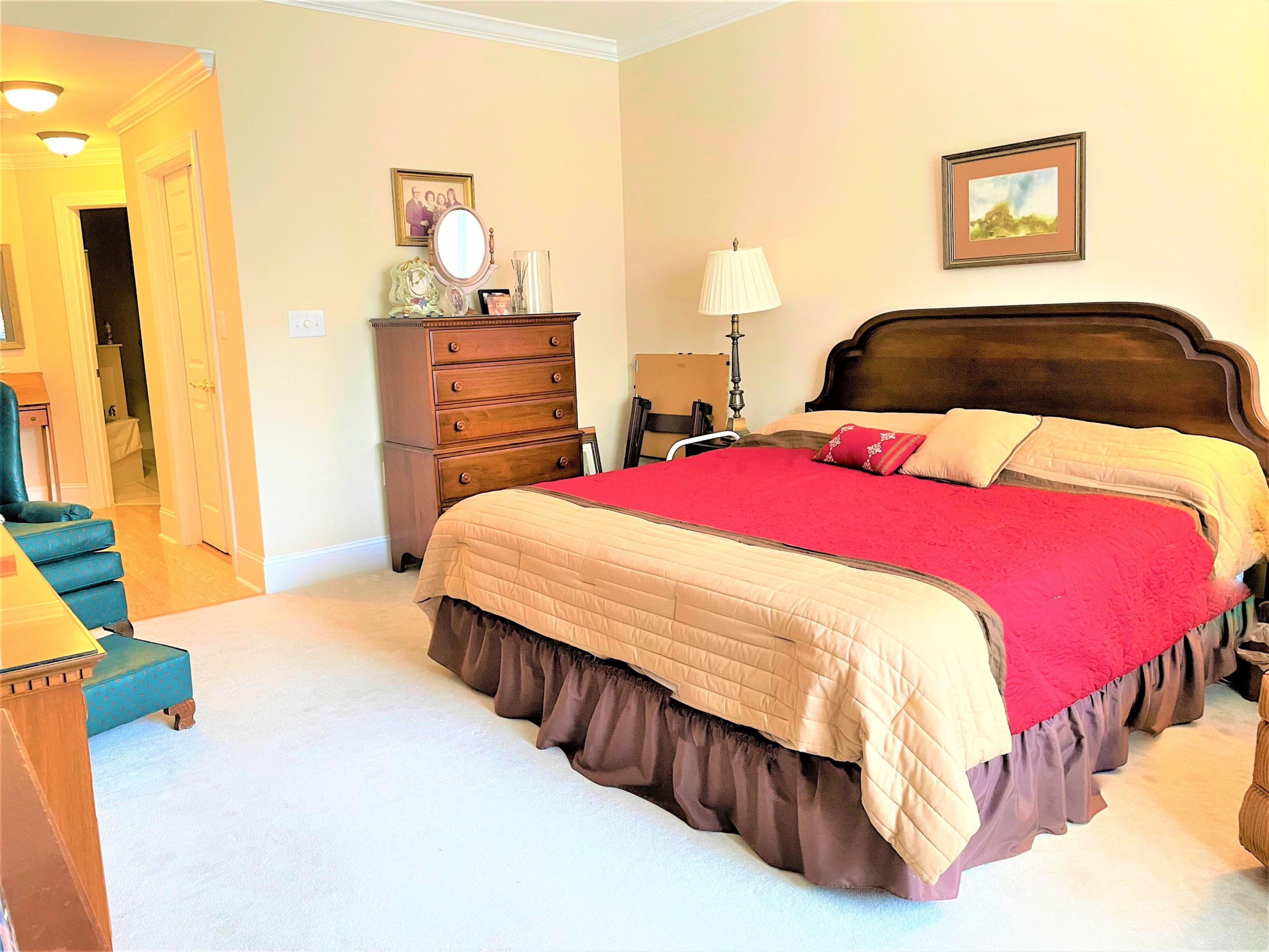 3700 Baron Cooper Pass, Unit 103 Raleigh, NC 27612 - Photo 17 of 24 Master Bedroom with Walk in Closet