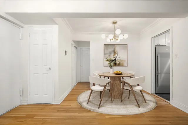 a view of an empty room and wooden floor