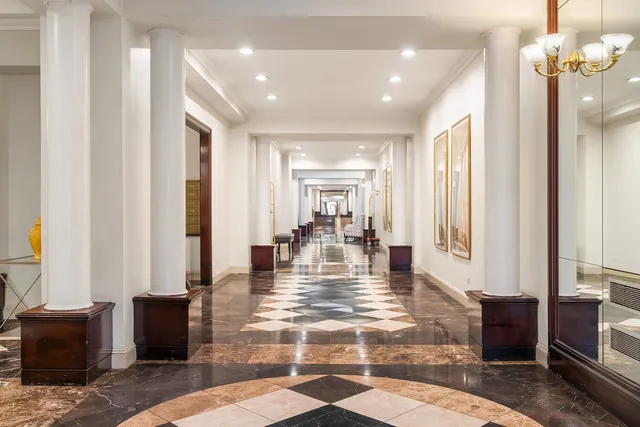 a bedroom with a large bed and a flat screen tv