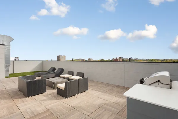 a terrace view with two chair and a potted plant