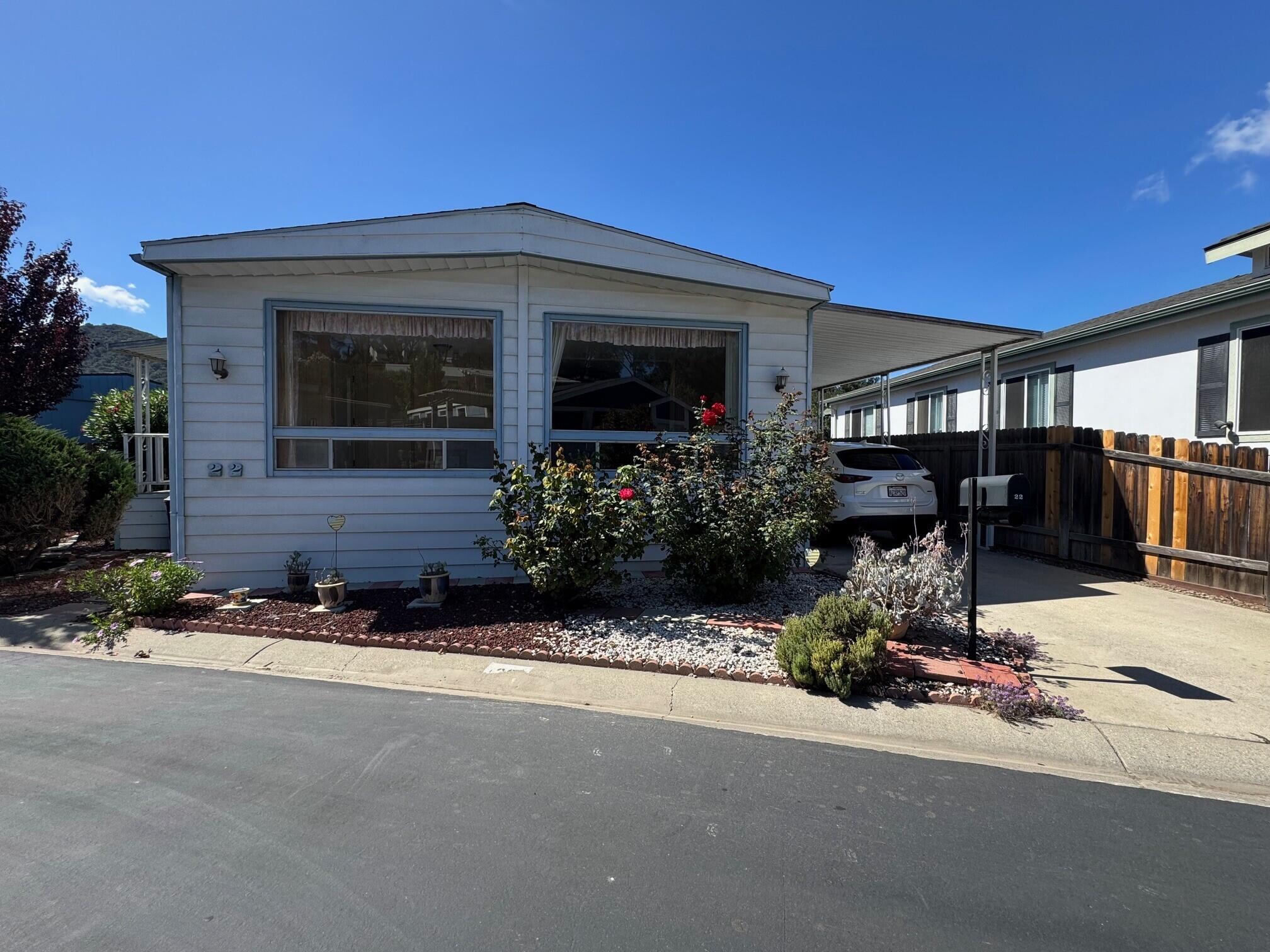 a view of house with outdoor space and porch