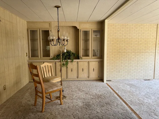 a view of a door and chair in the house