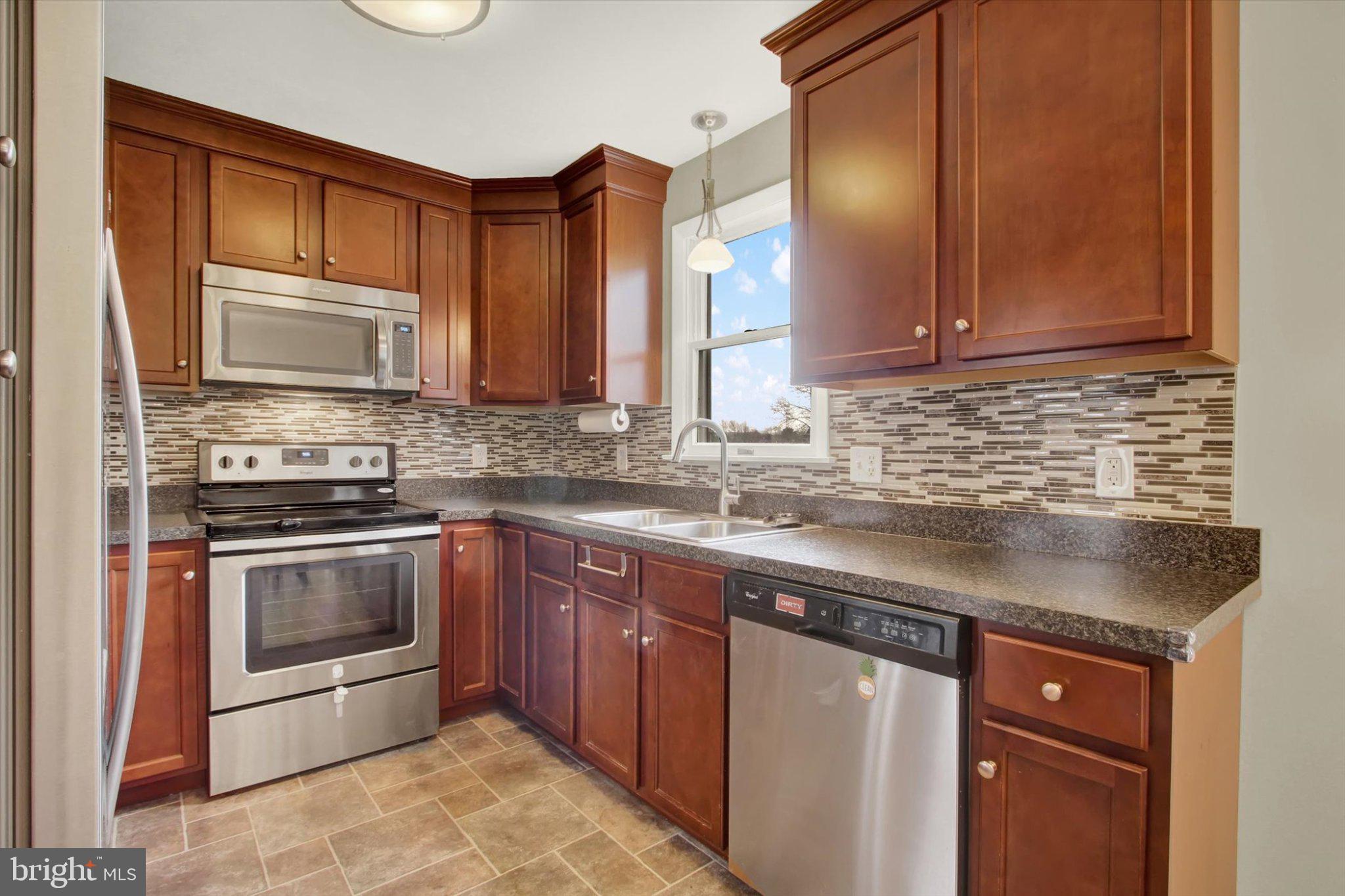 45 Lee Ann Court Hanover, PA 17331 - Photo 8 of 23 Modern kitchen with rich wood tones.