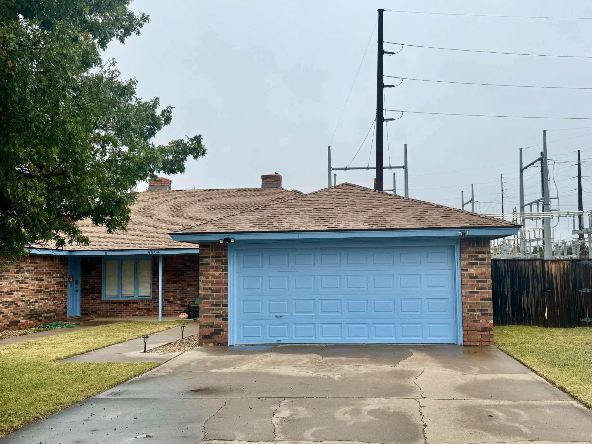 a front view of a house with a garage
