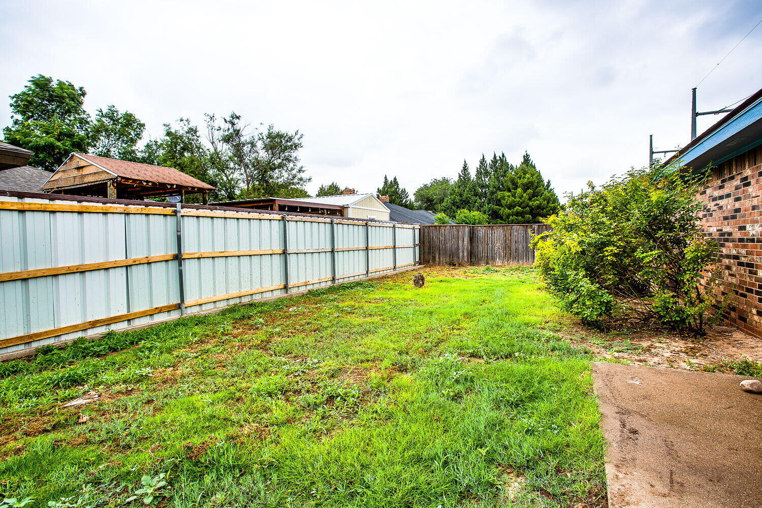 4804 76th Street, Unit A Lubbock, TX 79424 - Photo 24 of 31 a view of a backyard with a garden