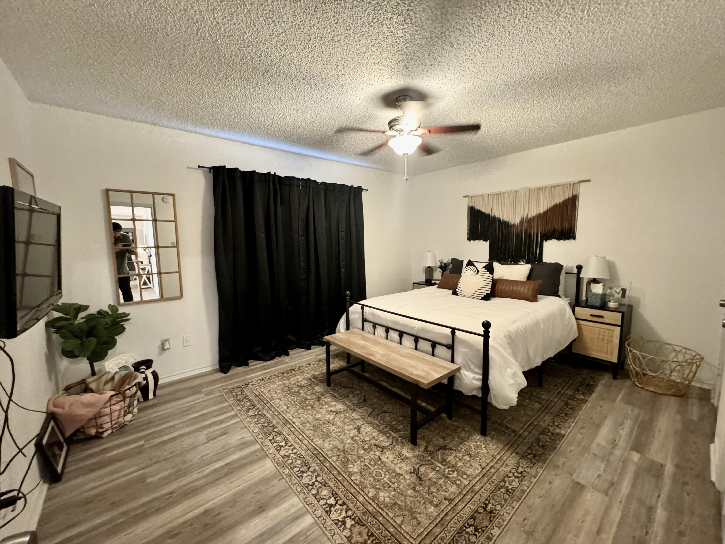 4804 76th Street, Unit A Lubbock, TX 79424 - Photo 27 of 31 a bedroom with a bed a dresser and window