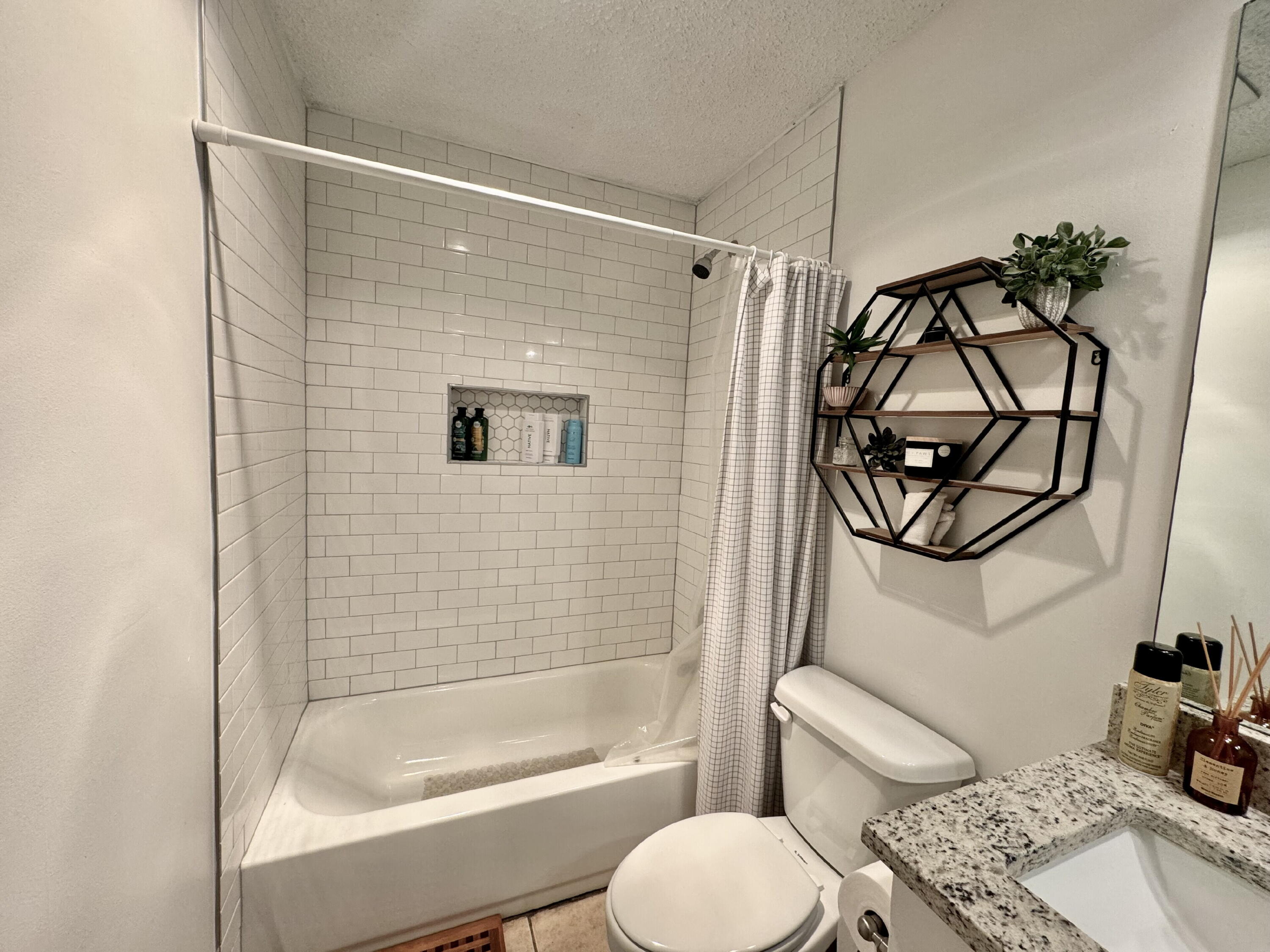 4804 76th Street, Unit A Lubbock, TX 79424 - Photo 28 of 31 a bathroom with a sink toilet and shower