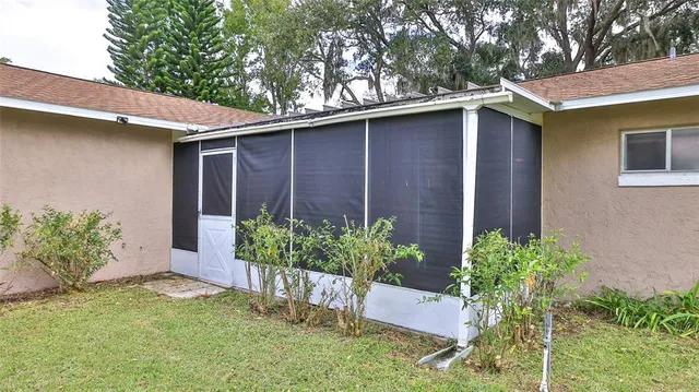 a kitchen with stainless steel appliances a sink a stove a refrigerator and cabinets