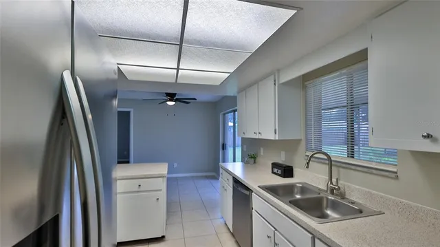 a kitchen with cabinets appliances and a sink