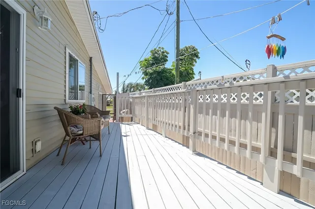 a view of a patio with table and chairs